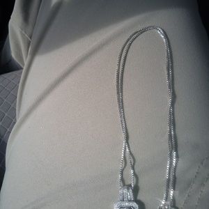 Diamond pendant with silver chain.